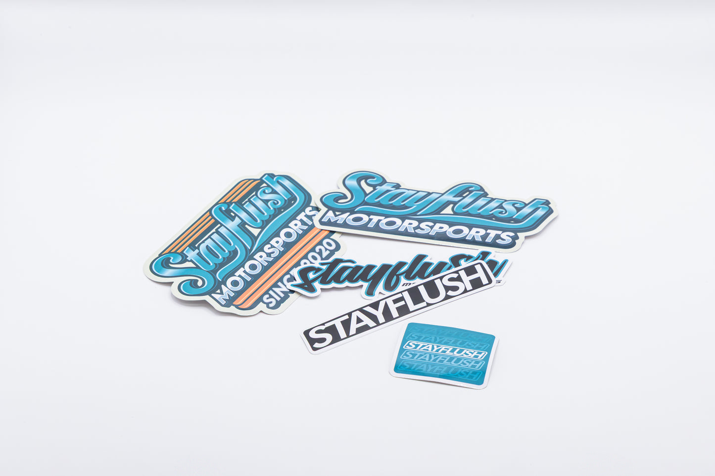 The StayFlush Motorsports Sticker Pack features high-quality stickers in various shapes, sizes, and colors, displayed on a plain white background.