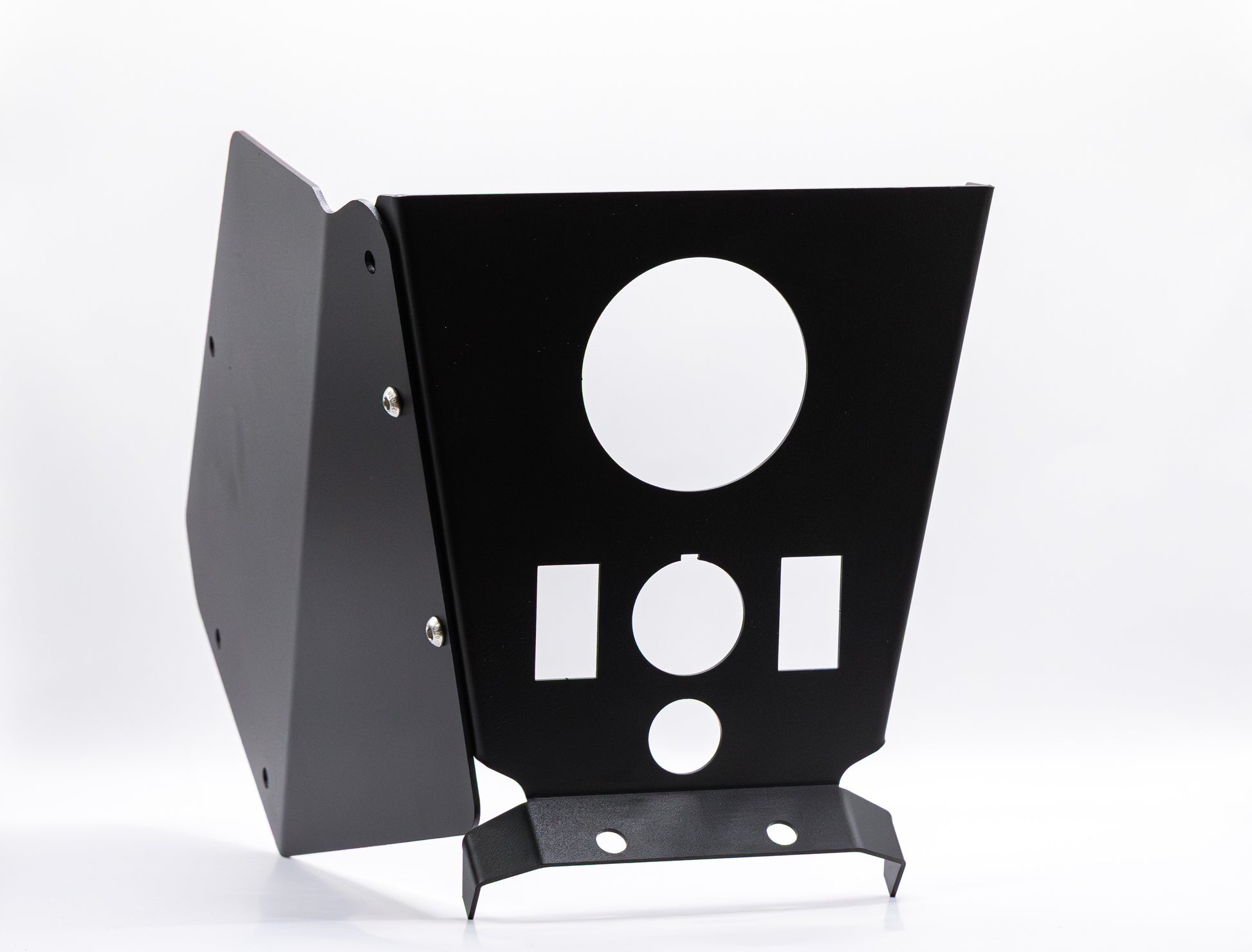 The StayFlush Cyclops Console + 2-Switch by StayFlush Motorsports is a black metal UTV center console with angled panels, multiple circular and rectangular cutouts, and visible side screws, shown upright on a white background.
