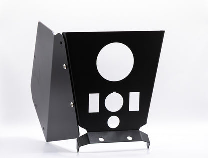 The StayFlush Cyclops Console + 2-Switch by StayFlush Motorsports is a black metal UTV center console with angled panels, multiple circular and rectangular cutouts, and visible side screws, shown upright on a white background.