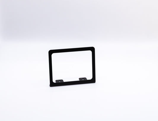 The Switch-Pros 12 Sidekick Accessory Mount from StayFlush Motorsports is a small, rectangular black metal mount with two mounting holes at the base, shown upright against a plain white background.